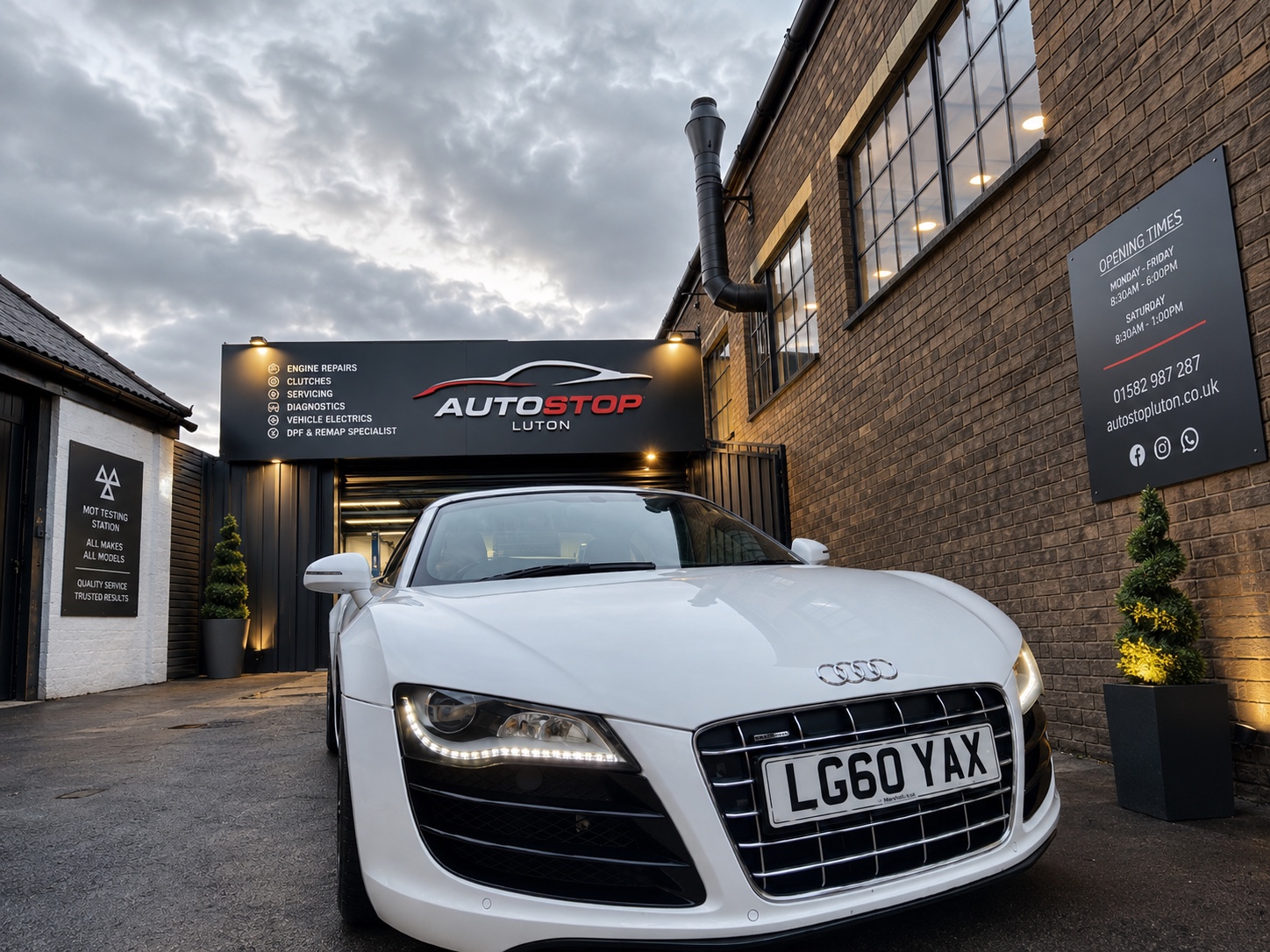 A white Audi outside the Autostop Luton garage